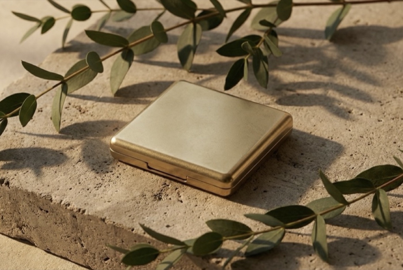 The Loom Floss Compact — a weighted metal compact with a built-in mirror